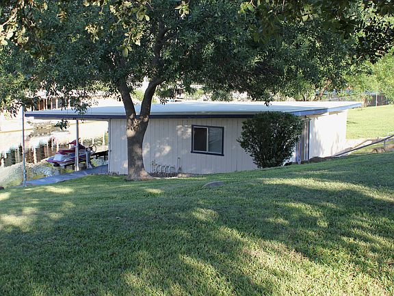 Weather enclosed boat house with many amenities.