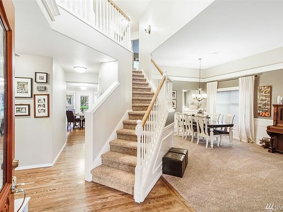 Walk into vaulted ceilings and open space!  The home has BRAND NEW carpet.