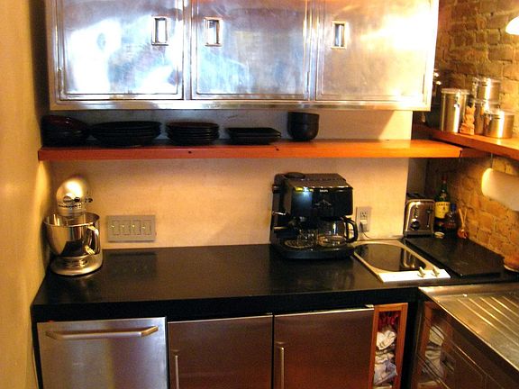 Kitchen with stainless dishwasher, fridge, & freezer (upstairs)