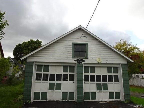 Two car garage, separated per unit- has electricity.