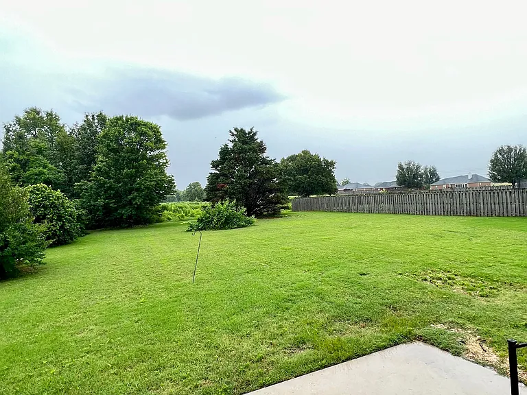 0.5 acre with surrounding fences on each side