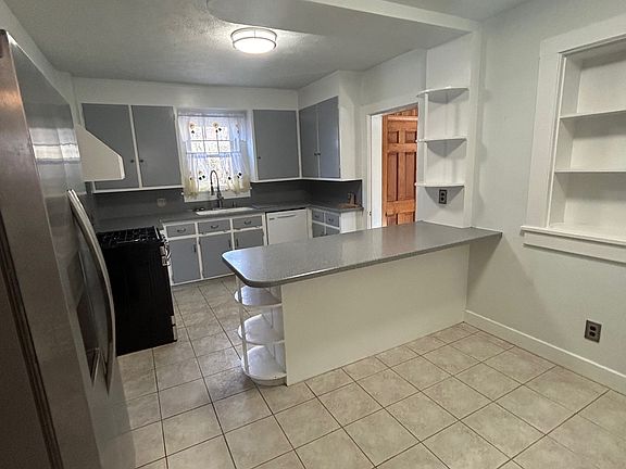 Kitchen Island and Eat in Table Space. Great built in shelves and corner cupboard (not in pic)