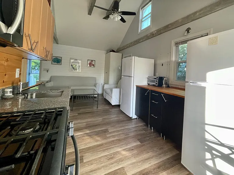 Full kitchen with two fridges, dishwasher, gas stove, and all basic cooking and baking supplies, dishware, glassware, and silverware.