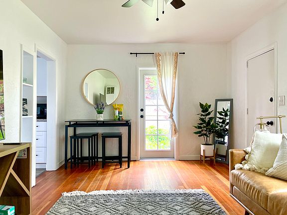 Dining table and chairs can be pulled out when needed or stored against the wall to give more space in the living area.