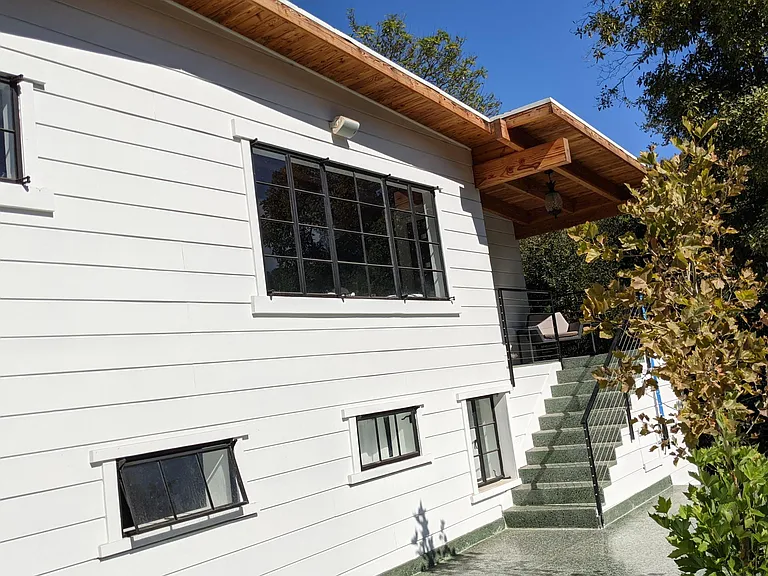 Front Facade of house + staircase to front door.