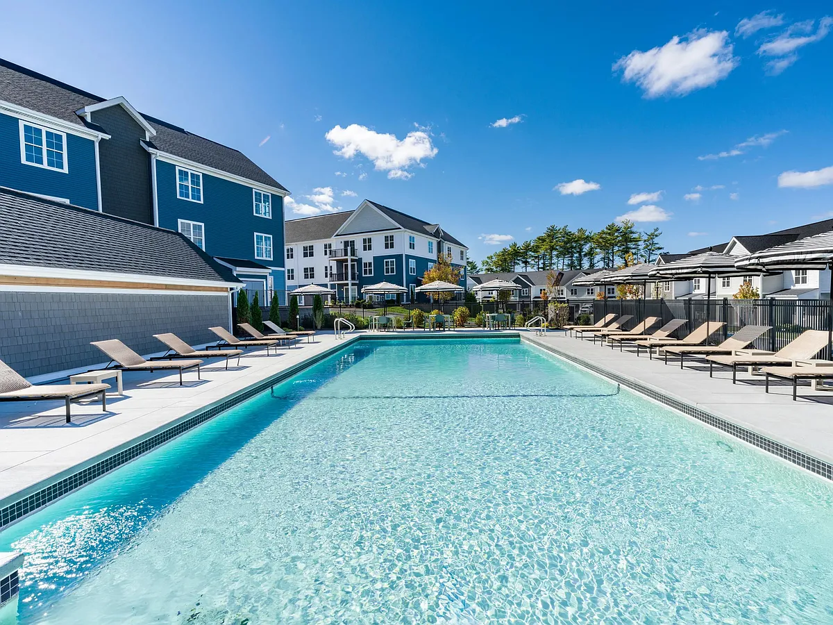This refreshing pool is the centerpiece of our outdoor amenities_perfect for swimming laps or relaxing in the sun-drenched lounge area. - Modera South Shore