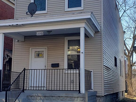 Front of house with porch.