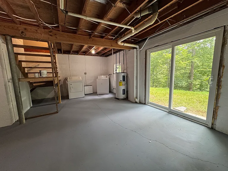 Basement with laundry area.