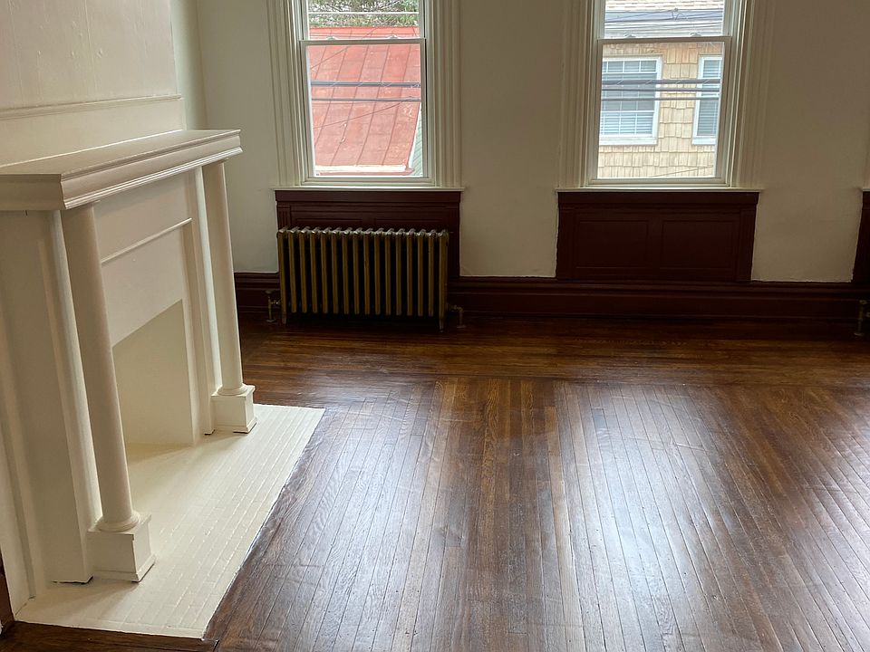 Roomy bedroom with refinished hardwood