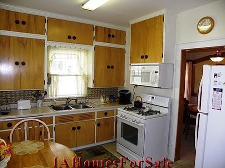 Kitchen w/ Ceramic Tile flooring and ceramic tile backsplash. Large Built-in bread board for extra counter space.  All new appliances fall 2008.