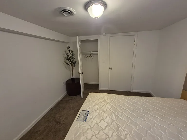Clean, unfurnished option with closet _ ready for your own setup.