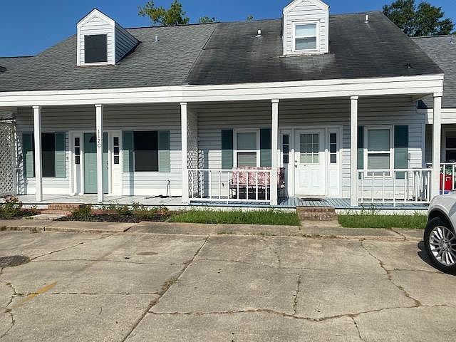 front entrance with 2 parking spaces - unit available has green door
