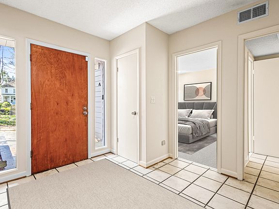 Natural light enhances the bright, welcoming entryway.
