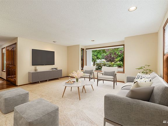 Living room looking toward entry. Lots of space, lots of natural light.>