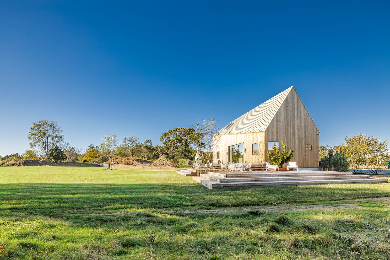  Lawn area by house with meadow