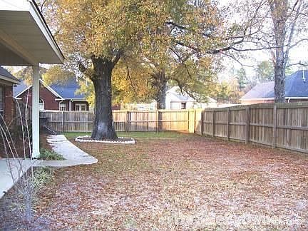 Wood privacy fence around back yard