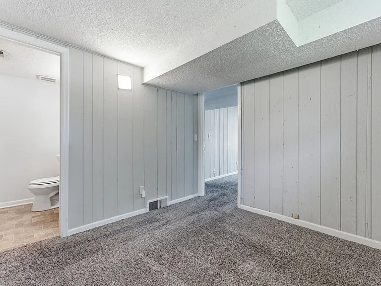 Downstairs room with half bath