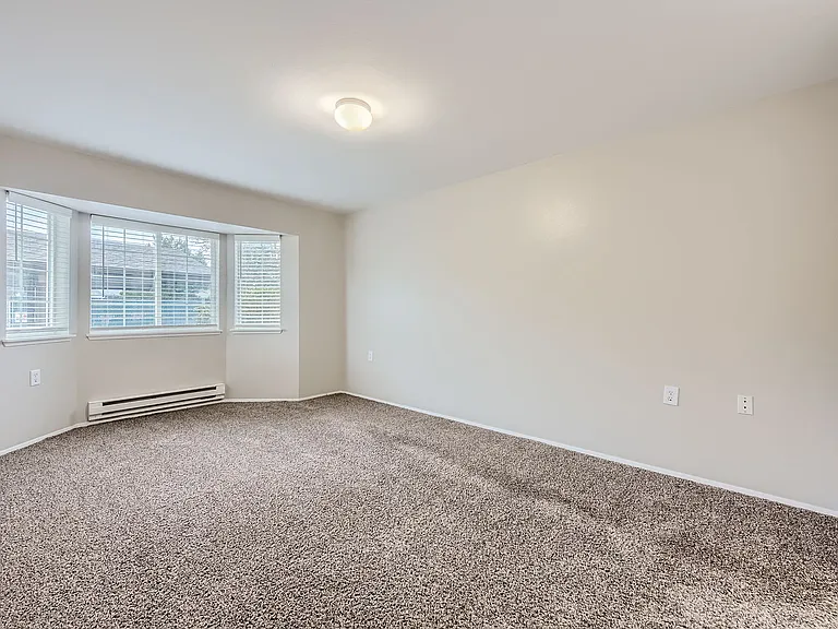 Primary bedroom in a two-bedroom two-bath apartment at Capitol City in Lacey, WA