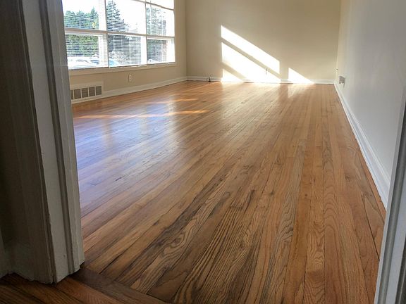 Living room with lots of lights, big windows. Re-polished floors