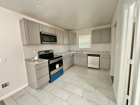 Spacious kitchen with pantry and laundry room