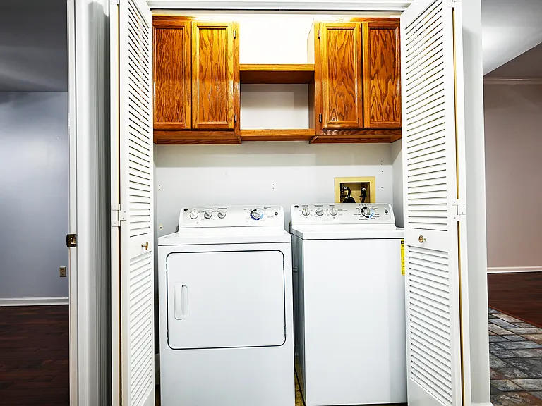 Laundry area comes with washer and dryer.