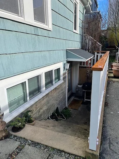 Entrance to the apartment on the south side of the driveway.