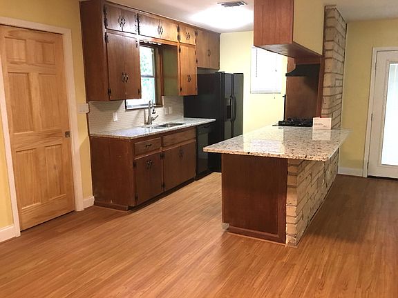 Generous granite breakfast counter in center of living/dining area.