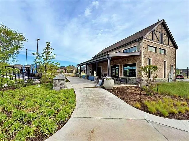Enjoy premier community social spaces just steps away_perfect for meeting neighbors and family gatherings.