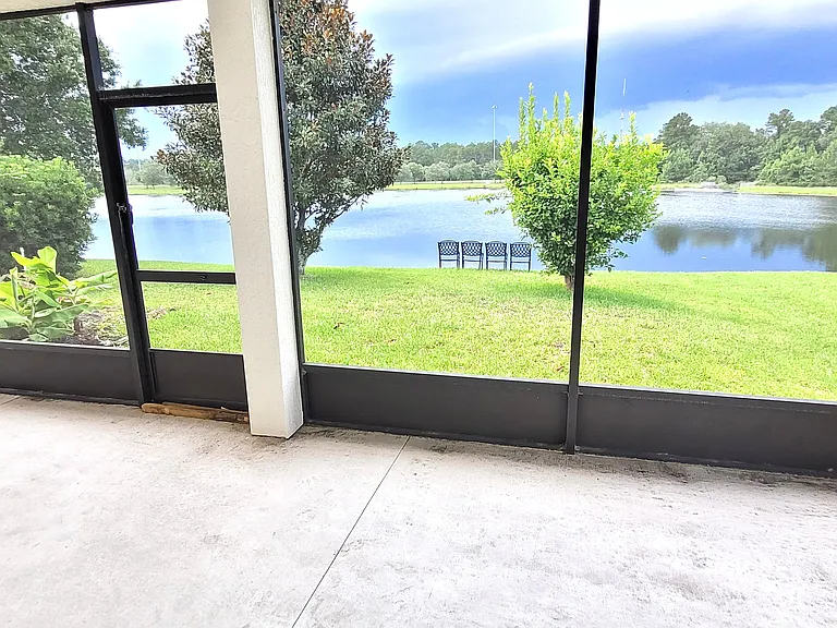 Large extended Screened Lanai with Lake View. Perfect for outdoor resort style living