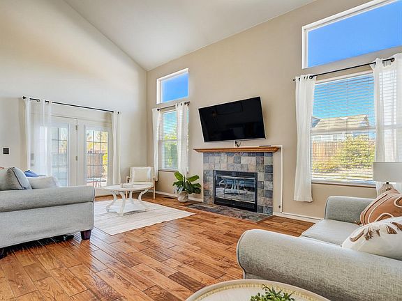 Living room has a smart TV and a cozy fireplace!