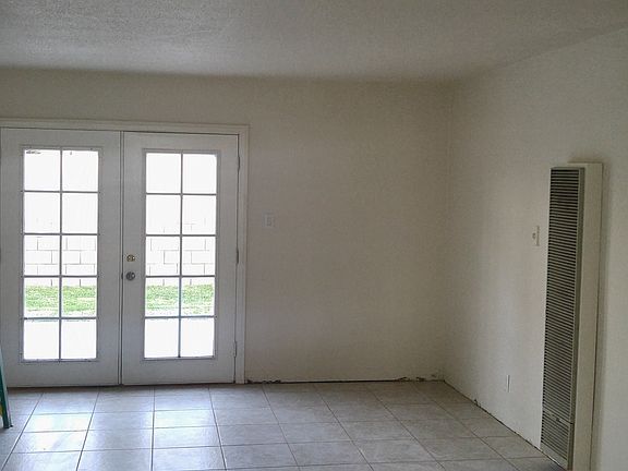 Living Room with New Tile Floor and Paint and French Doors