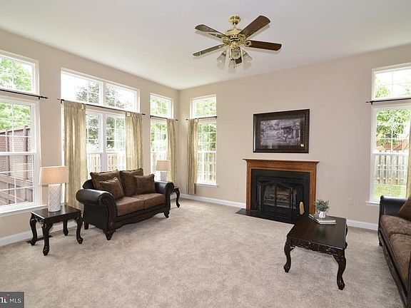 Light-filled family room with fireplace.