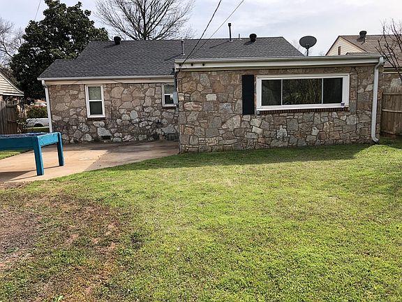 Backyard that is totally fenced.