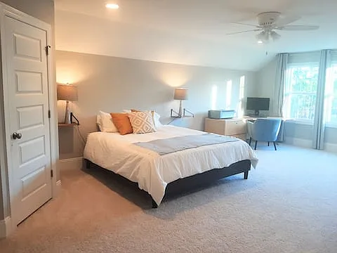 3rd story suite with walk-in closet and full bathroom.
