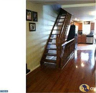 Glowing hardwood floors and floating staircase...