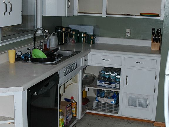 Freshly painted cupboards with new hardware(soon as Home Depot gets my hinges)