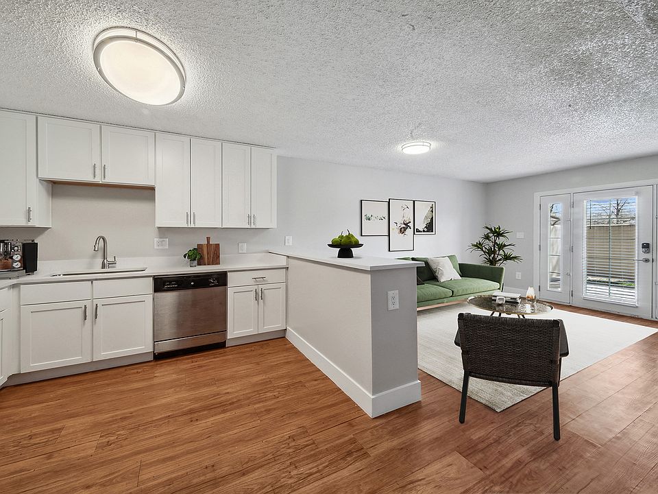 Widespread kitchens with a spacious living room that opens out to a balcony