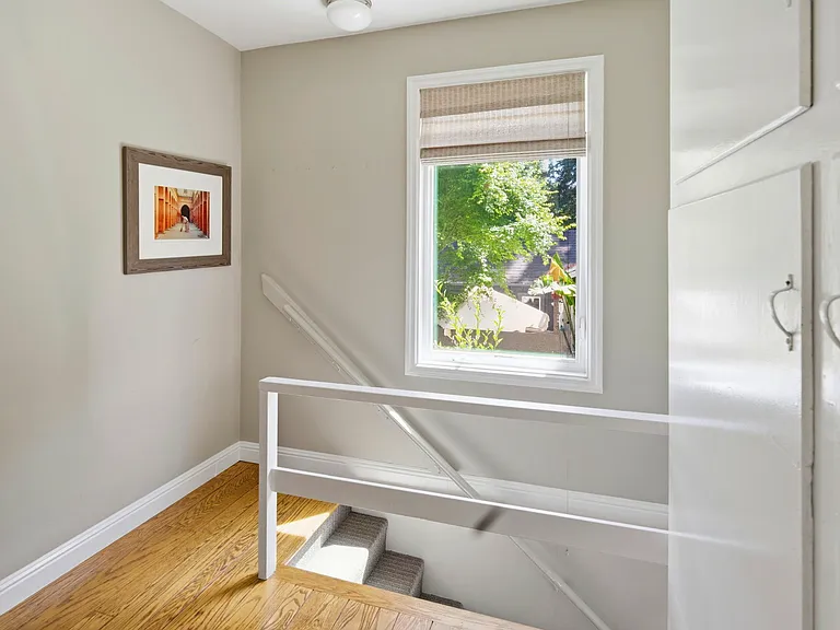 These stairs are off the kitchen and lead you downstairs to the family room, another bedroom and two bathrooms and a laundry room.