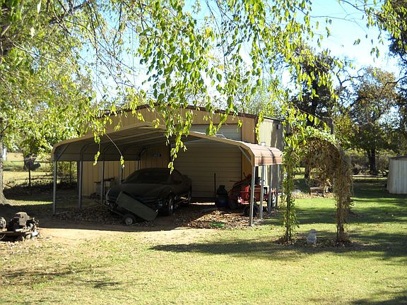 2 Car Rarport with Oversized Roll-Up Shop Door