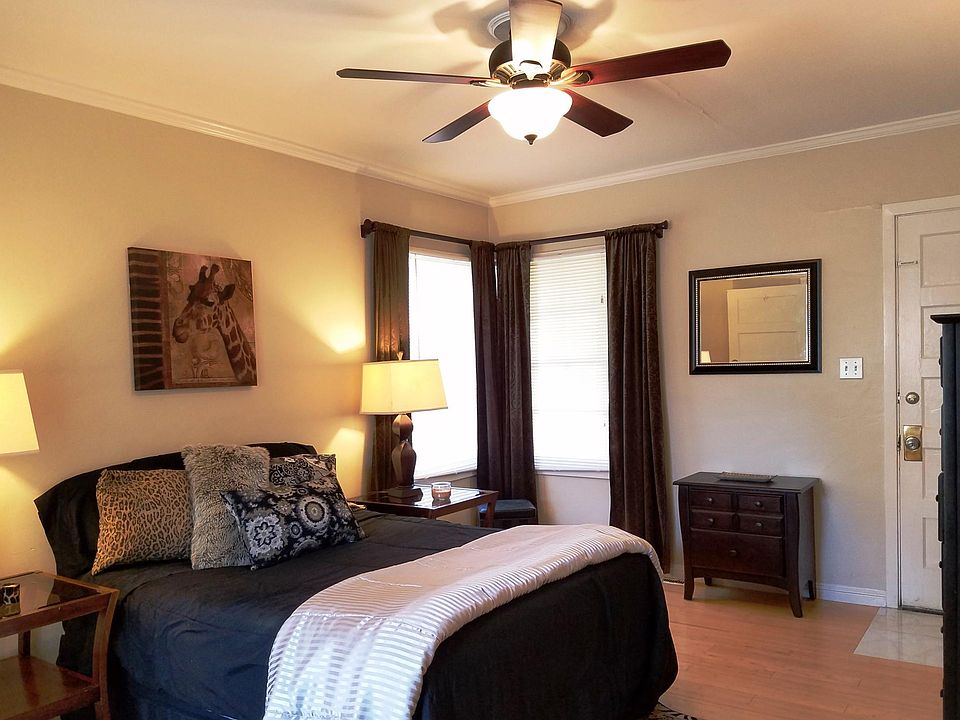 Bedroom prior to reconstruction. Door at right is now a dual pane window.