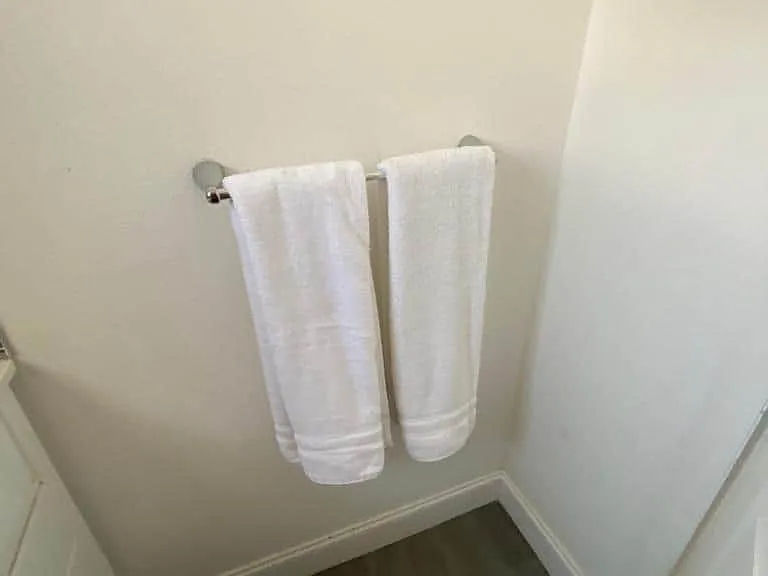 Provided with towel racks and fresh towels for a comfortable stay.