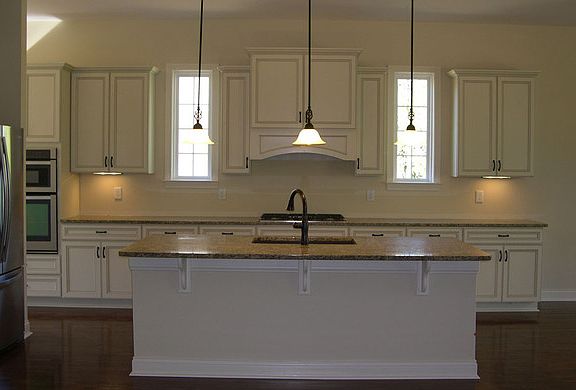 The Rowan Kitchen with large island and pendant lights