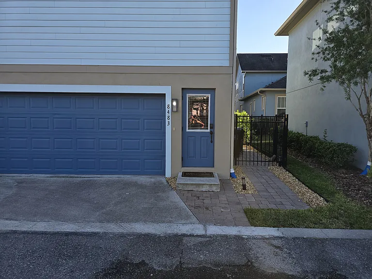 Another angle of front door and paver walkway.