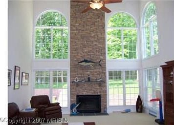 Family room with Stacked stone Fireplace