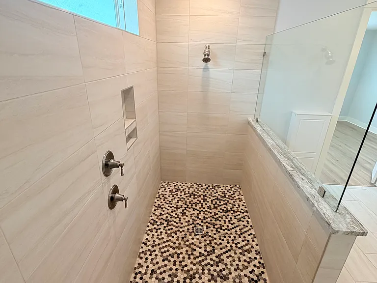 Elegant bathroom with a spacious walk-in shower and sleek, upgraded design