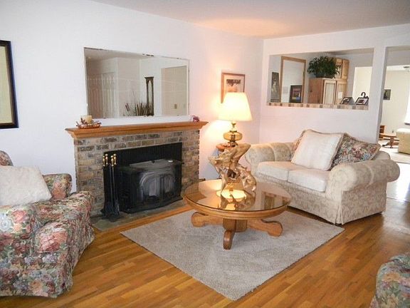 Charming living room with great hardwood floors and lots of light. I am standing at the front door.