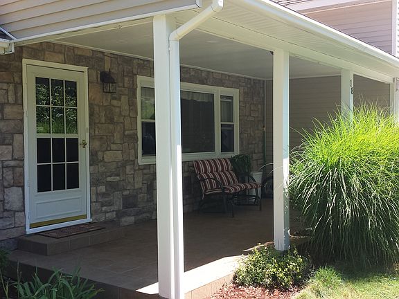 Tiled, covered front porch