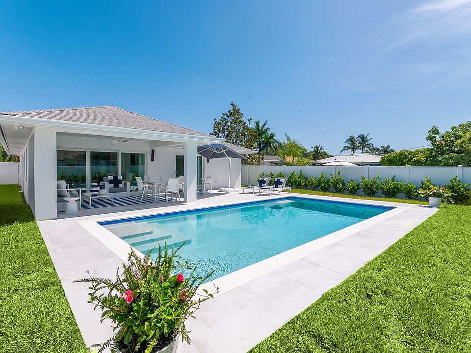 The heated saltwater pool is accessed through the great room and primary bedroom. The private back yard is fully-fenced. Pool cleaning and lawn care is included with the property.