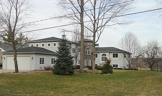 This striking home on beautiful main Sanford Lake with a little over 4500 sq. ft. offers a tremendou