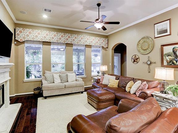 Living area with view of pool/spa